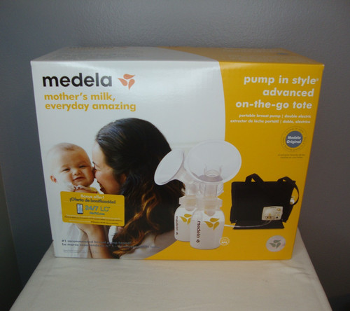 Medela portable breast - pump, in